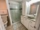 Bathroom featuring stylish shower with glass door and vessel sink on vanity at 1118 Magnolia Se Way, Smyrna, GA 30082