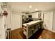 Cozy kitchen with stainless steel appliances, white cabinets, and a breakfast bar with stylish seating at 1118 Magnolia Se Way, Smyrna, GA 30082