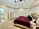 Main bedroom boasting a tray ceiling, soft carpet, and stylish furnishings at 1118 Magnolia Se Way, Smyrna, GA 30082