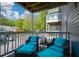Relaxing balcony seating with bright blue cushions and a scenic view of the surrounding neighborhood at 1602 Gettysburg Pl, Sandy Springs, GA 30350