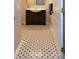 Charming bathroom with dark vanity, white sink and delightful black and white polka-dot tiled floors at 1602 Gettysburg Pl, Sandy Springs, GA 30350