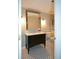 Bathroom with a large mirror, vanity with storage, and black-and-white mosaic flooring at 1602 Gettysburg Pl, Sandy Springs, GA 30350