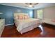 Bedroom with hardwood floors, a ceiling fan, large windows, and a queen-sized bed at 1602 Gettysburg Pl, Sandy Springs, GA 30350
