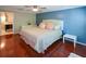 Bedroom with hardwood floors, a ceiling fan, large windows, and a queen-sized bed at 1602 Gettysburg Pl, Sandy Springs, GA 30350