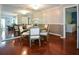 Charming dining room with hardwood floors, mirror accent wall, and adjacent living spaces at 1602 Gettysburg Pl, Sandy Springs, GA 30350