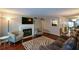 Inviting living room showcases a fireplace, TV, and hardwood floors at 1602 Gettysburg Pl, Sandy Springs, GA 30350