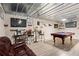 Finished basement with a pool table, lounge area, and bar for entertaining at 262 Royal Crescent Ter, Canton, GA 30115