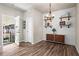 Lovely dining area with modern light fixture and shelves perfect for entertaining at 262 Royal Crescent Ter, Canton, GA 30115