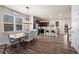 Dining area with a modern table, decorative lighting, and an open view to the kitchen at 262 Royal Crescent Ter, Canton, GA 30115