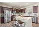 Well-equipped kitchen with stainless steel appliances, a kitchen island, and ample counter space at 262 Royal Crescent Ter, Canton, GA 30115