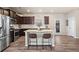 Modern kitchen featuring stainless steel appliances, granite countertops, and a breakfast bar at 262 Royal Crescent Ter, Canton, GA 30115