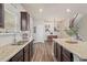 Bright kitchen with island, granite countertops, stainless appliances, and eat in area at 262 Royal Crescent Ter, Canton, GA 30115