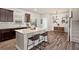 A spacious kitchen showcasing an island, ample cabinetry, and an adjacent dining area at 262 Royal Crescent Ter, Canton, GA 30115