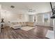 Spacious living room featuring a large sectional, ceiling fan, and hardwood floors at 262 Royal Crescent Ter, Canton, GA 30115