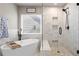 Modern bathroom featuring a standalone tub and walk-in shower with a glass enclosure at 262 Royal Crescent Ter, Canton, GA 30115