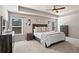 Relaxing bedroom with a tray ceiling, soft carpet, and matching furniture set at 262 Royal Crescent Ter, Canton, GA 30115