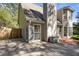 Back exterior view of deck and rear of the house with lush landscaping at 591 Briarmeade Sw Dr, Marietta, GA 30064