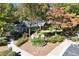 Community clubhouse surrounded by landscaped grounds, trees, and walking paths at 591 Briarmeade Sw Dr, Marietta, GA 30064
