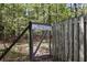 Rustic wooden fence and gate with 'Gateway to American History' sign, surrounded by lush greenery at 591 Briarmeade Sw Dr, Marietta, GA 30064