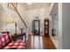 Elegant foyer with hardwood floors, a staircase, and decorative front door with transom window at 591 Briarmeade Sw Dr, Marietta, GA 30064
