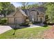 Charming home with a lush landscaped yard, a two-car garage, and traditional architectural details at 591 Briarmeade Sw Dr, Marietta, GA 30064
