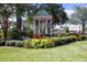 Scenic view of a gazebo nestled within a lush garden landscape at 591 Briarmeade Sw Dr, Marietta, GA 30064