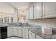 Kitchen with white cabinets, granite countertops, and stainless steel appliances at 591 Briarmeade Sw Dr, Marietta, GA 30064