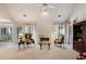 Cozy living room with a fireplace, large windows with natural light, and vaulted ceilings at 591 Briarmeade Sw Dr, Marietta, GA 30064