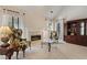 Cozy living room featuring a fireplace, two windows with natural light and neutral colored carpet at 591 Briarmeade Sw Dr, Marietta, GA 30064