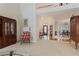 Open-concept living spaces with dining area, foyer, and staircase with white railing at 591 Briarmeade Sw Dr, Marietta, GA 30064