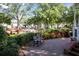 Beautiful park view with manicured hedges, flower beds, a fountain, and benches at 591 Briarmeade Sw Dr, Marietta, GA 30064