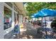 Quaint street view with Updog storefront, sidewalk tables, and a menu board at 591 Briarmeade Sw Dr, Marietta, GA 30064