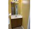 Bathroom featuring a vanity with a white countertop and brown cabinets at 1112 Gather Dr, Lawrenceville, GA 30043