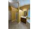 Bright bathroom featuring an enclosed shower, single sink vanity, and tile flooring at 1112 Gather Dr, Lawrenceville, GA 30043