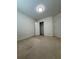 Bedroom with neutral carpet and two doors visible at 1112 Gather Dr, Lawrenceville, GA 30043