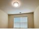 Bright room with a single window with blinds and a flush ceiling light at 1112 Gather Dr, Lawrenceville, GA 30043