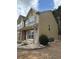 Side view of the two-story home showing siding, stone accents, and exterior features at 1112 Gather Dr, Lawrenceville, GA 30043