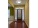 Inviting foyer with hardwood floors and transom windows over the front door at 1112 Gather Dr, Lawrenceville, GA 30043