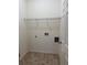 Small laundry room featuring hookups and tile flooring at 1112 Gather Dr, Lawrenceville, GA 30043