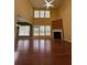 Open living room with high ceilings, large windows, and a fireplace at 1112 Gather Dr, Lawrenceville, GA 30043