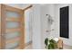Bright bathroom space with a wood-framed door, soft towels, and minimalist decor for a clean aesthetic at 400 Village Ne Pkwy # 203, Atlanta, GA 30306