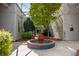Picturesque courtyard with a fountain, lush landscaping, and architectural details for a tranquil setting at 400 Village Ne Pkwy # 203, Atlanta, GA 30306
