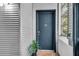 Stylish apartment entrance with modern door, welcoming mat, and a glimpse of natural light at 400 Village Ne Pkwy # 203, Atlanta, GA 30306