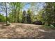 Picturesque view of a community green space with mature trees and a tranquil sitting area, ideal for relaxation at 400 Village Ne Pkwy # 203, Atlanta, GA 30306