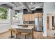 Modern kitchen featuring stainless steel appliances, island with seating, and stylish backsplash at 400 Village Ne Pkwy # 203, Atlanta, GA 30306