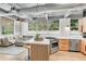 Modern kitchen with stainless steel appliances, stylish island with seating, and ample natural light at 400 Village Ne Pkwy # 203, Atlanta, GA 30306