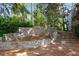 Stone-terraced landscaping with a decorative inlay provides an elegant entrance to the community at 400 Village Ne Pkwy # 203, Atlanta, GA 30306