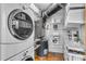 Functional laundry area with washer, dryer, and organized shelving for efficient storage solutions at 400 Village Ne Pkwy # 203, Atlanta, GA 30306