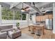 Open-concept living space with modern kitchen island, large windows, and comfortable seating area at 400 Village Ne Pkwy # 203, Atlanta, GA 30306