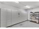 Well-lit package locker room with metal shelving and secure package management system for resident convenience at 400 Village Ne Pkwy # 203, Atlanta, GA 30306